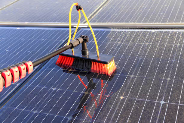 A professional cleaning a solar panel in Springfield, MO.